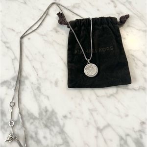Michael Kors silver toned necklace with rhinestone pendant